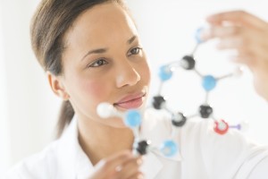 Doctor Examining Molecular Structure In Laboratory